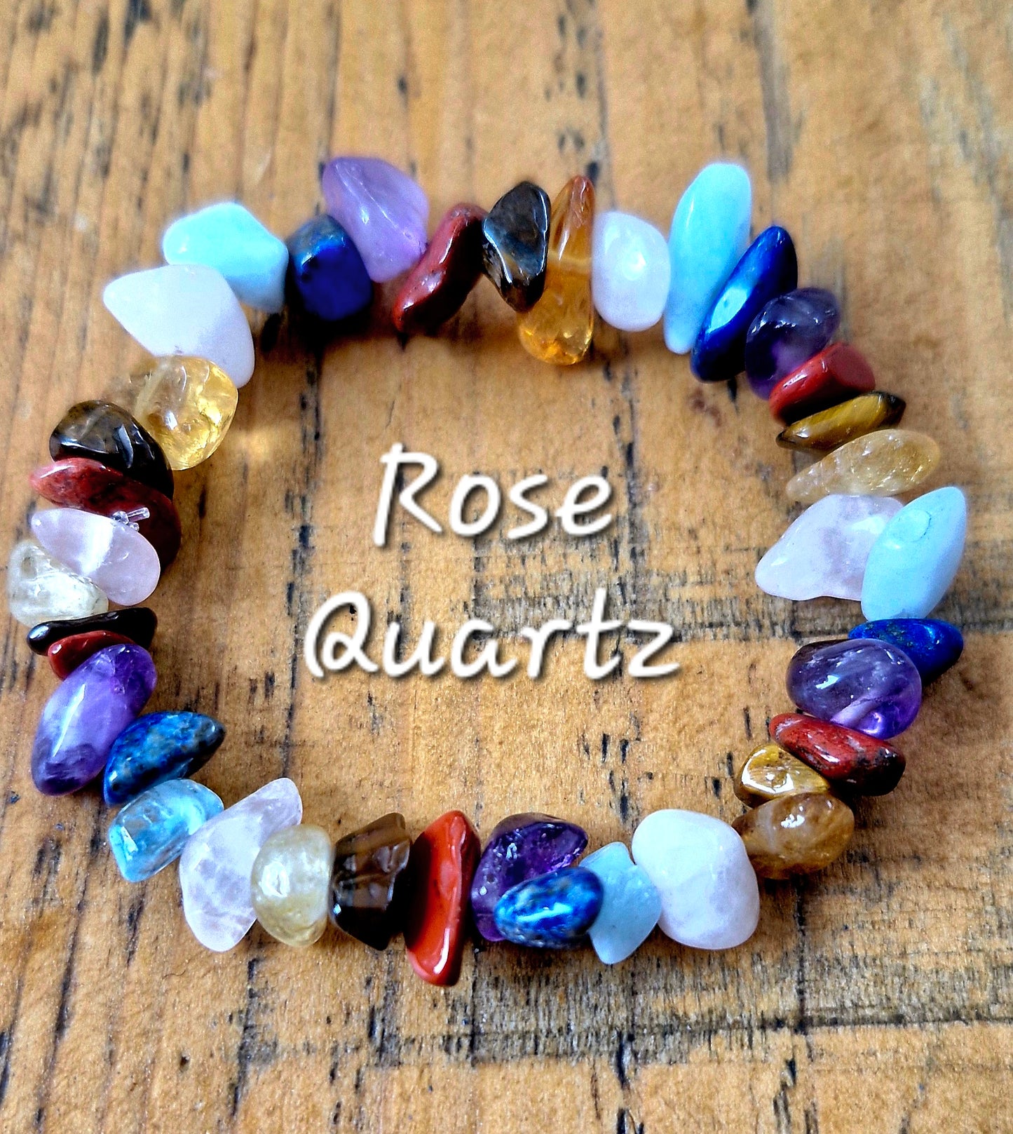 Handmade multicolor chakra chip bracelet with natural gemstones including Red Jasper, Tiger Eye, Citrine, Green Aventurine or Rose Quartz, Aquamarine, Lapis Lazuli, and Amethyst on stretch cord