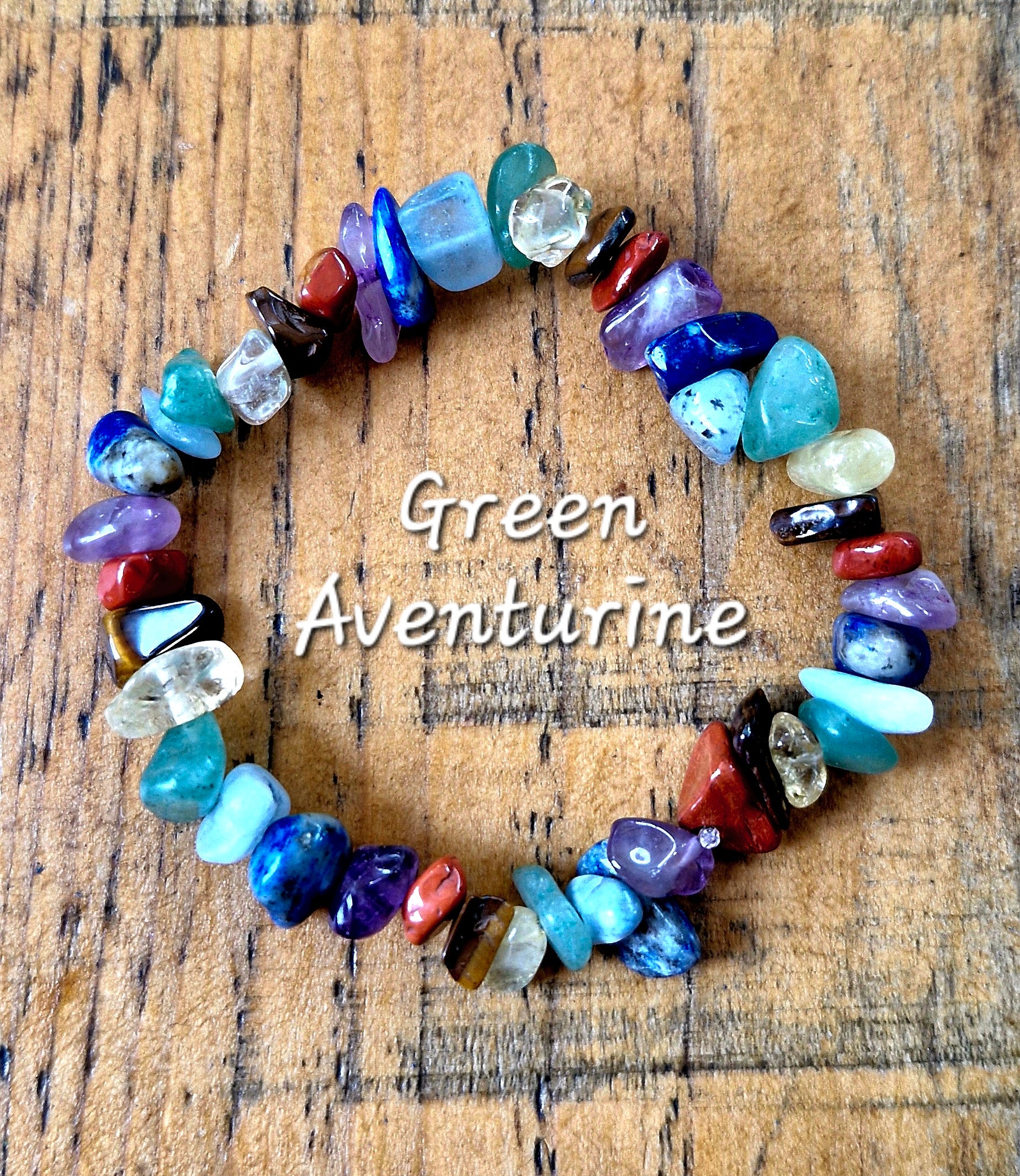 Close-up of handmade chakra bracelet with natural gemstone chips for spiritual healing and energy balance