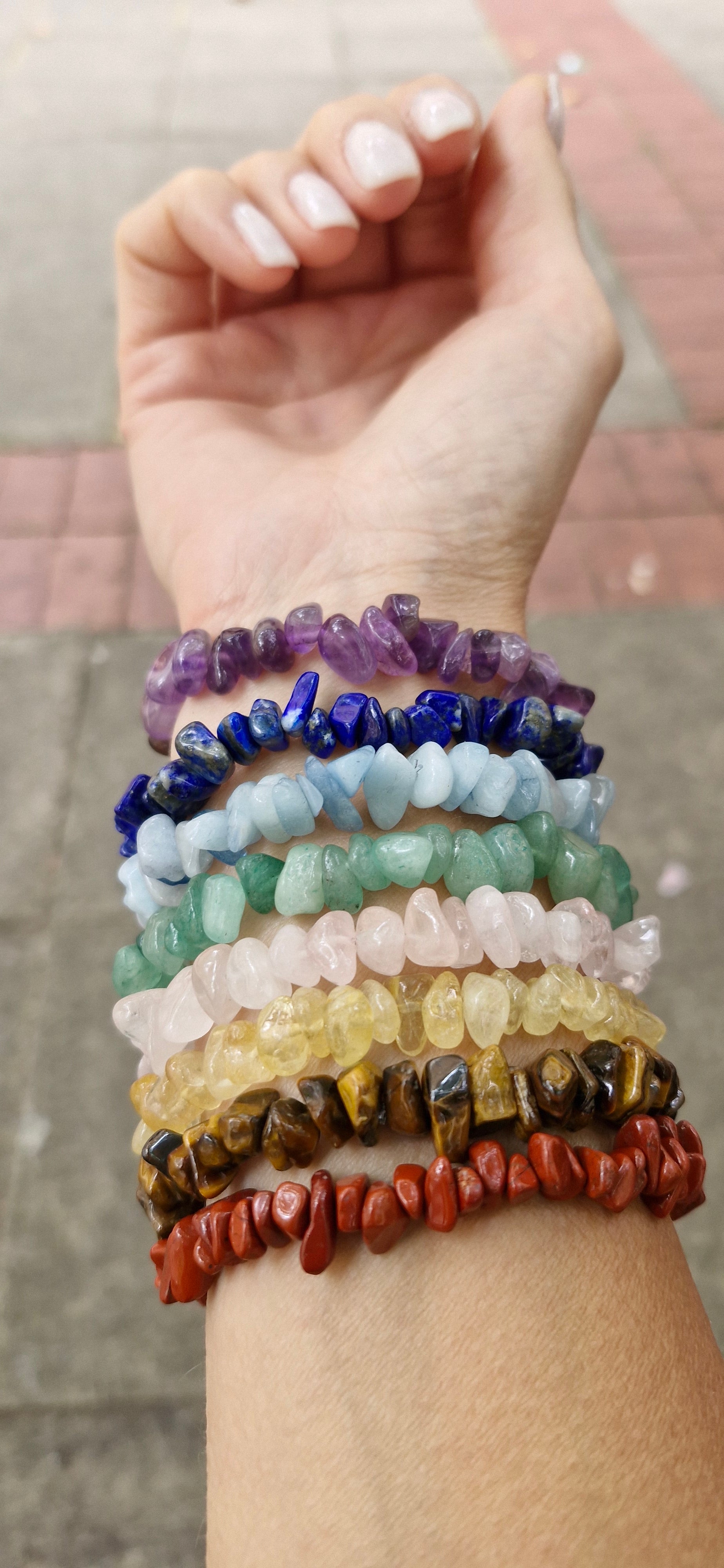 Natural gemstone chakra bracelet with colorful crystal chips on stretch cord for energy healing
