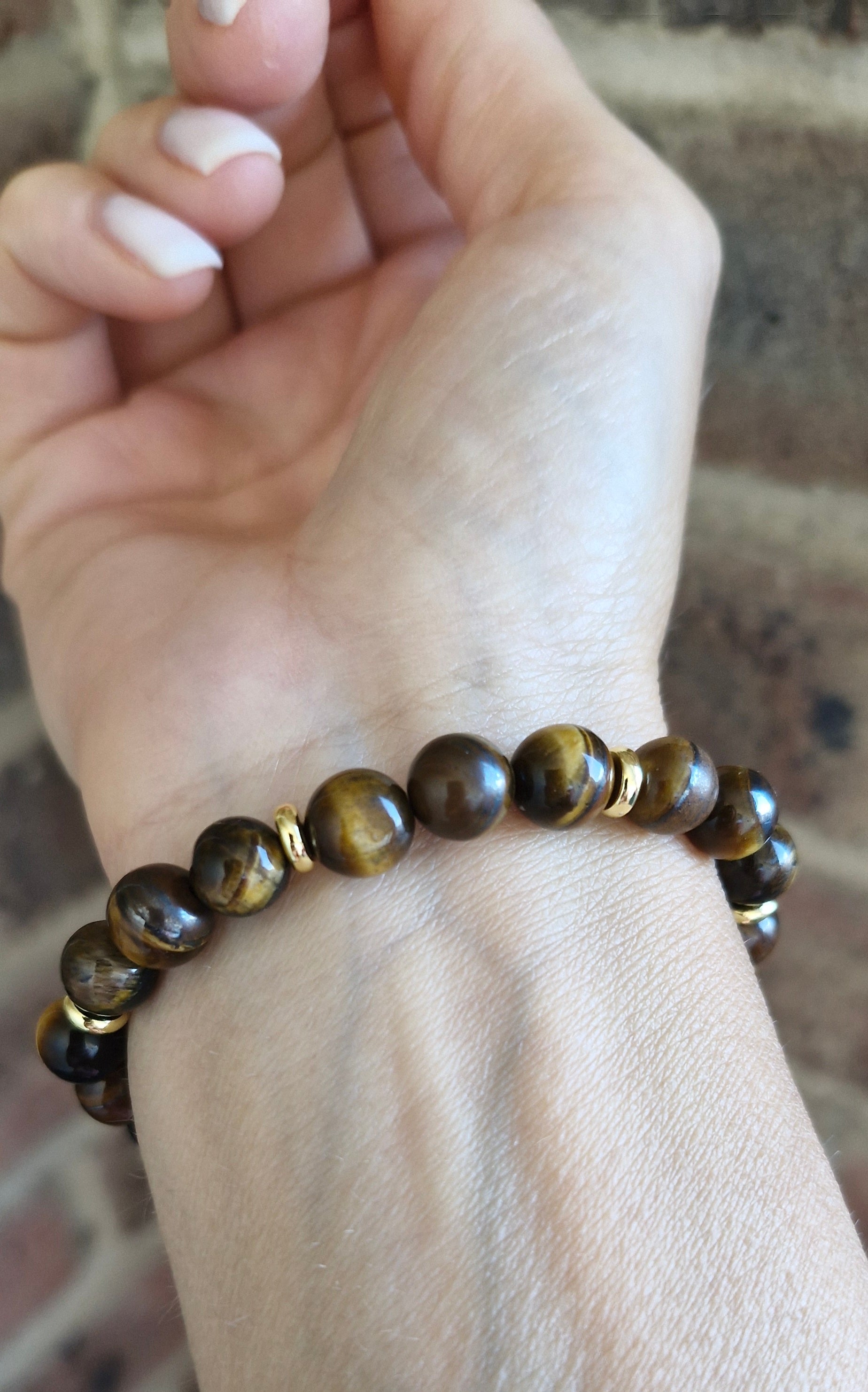 Handcrafted Tiger Eye crystal bracelet with shimmering golden tones and 6mm gold plated brass disk