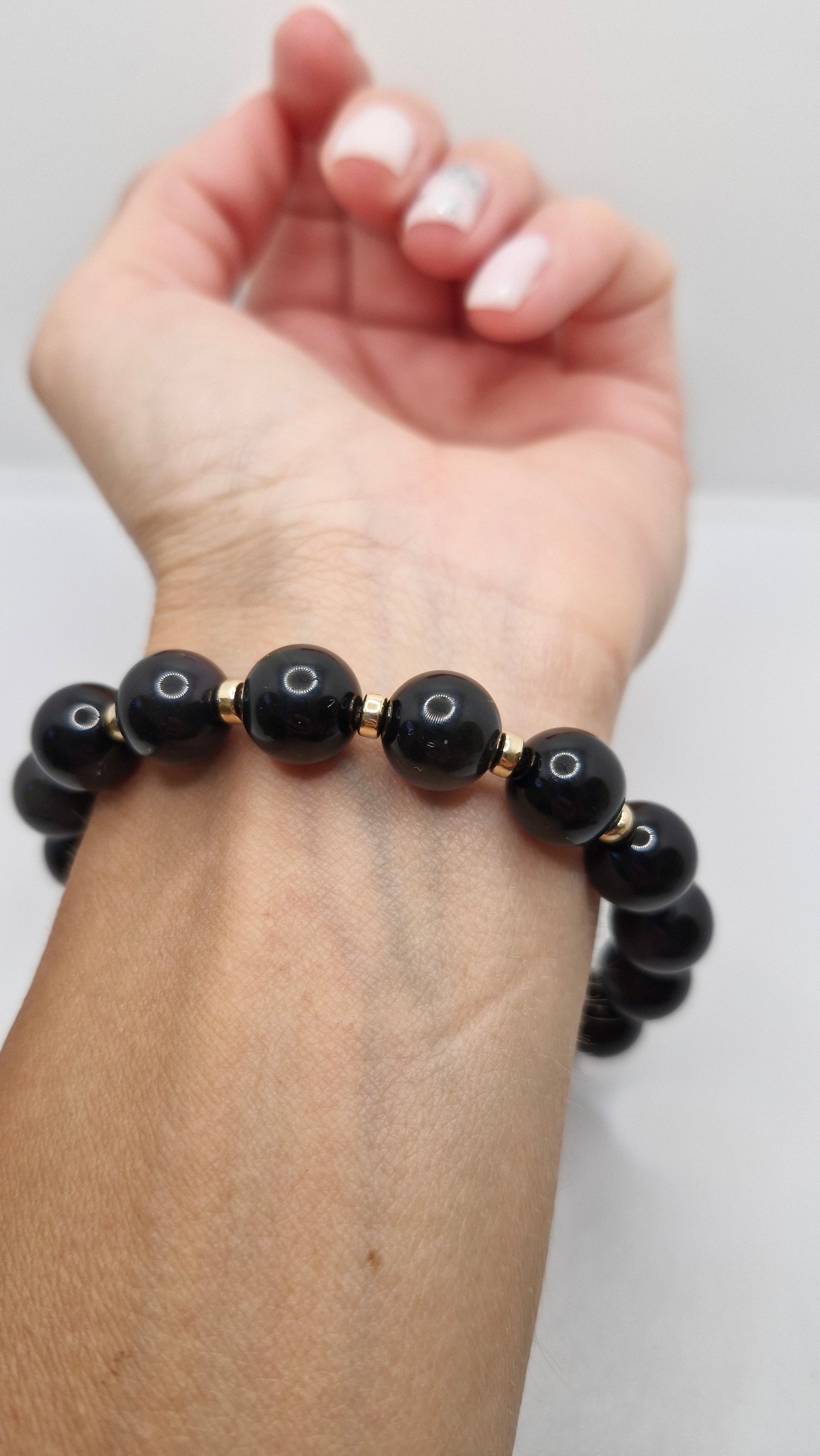 Durable 4mm Gold Filled bead, tarnish-resistant and elegant, used as an accent in handmade gemstone jewellery.