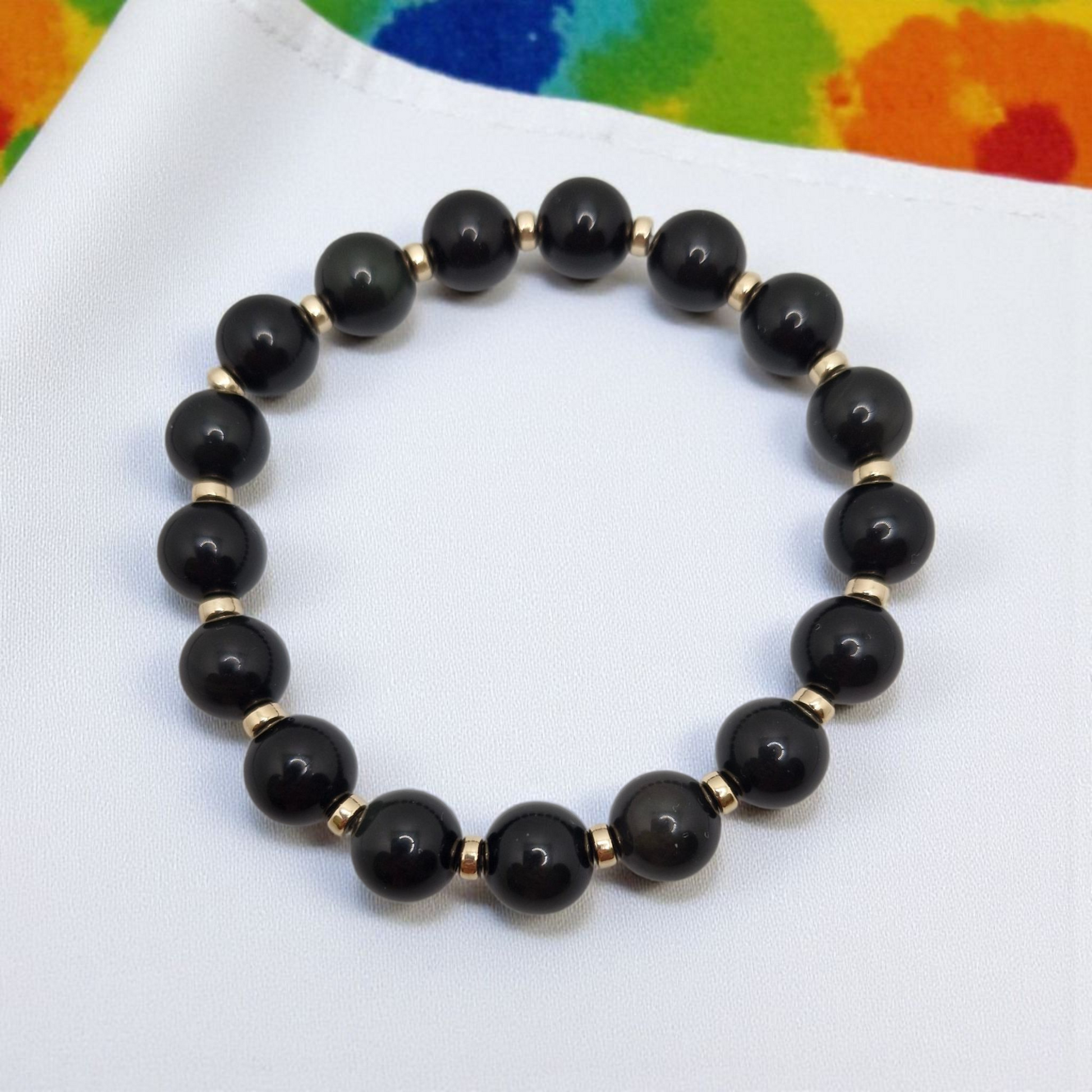 Handmade Black Obsidian stretch bracelet with 4mm Gold Filled rondelle bead, unisex gemstone jewelry.