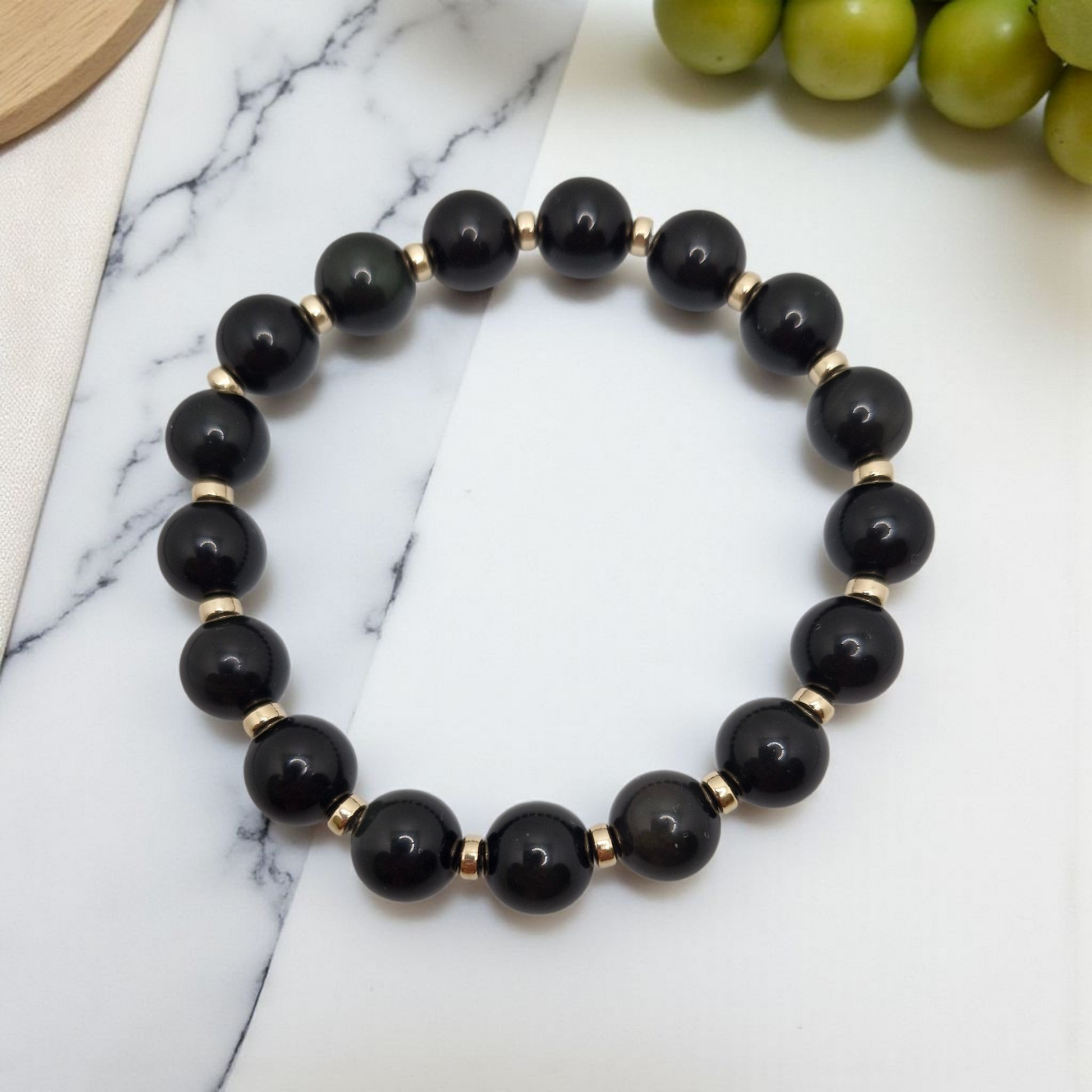 Natural Black Obsidian bracelet accented with durable 4mm Gold Filled rondelle bead, lightweight and comfortable.