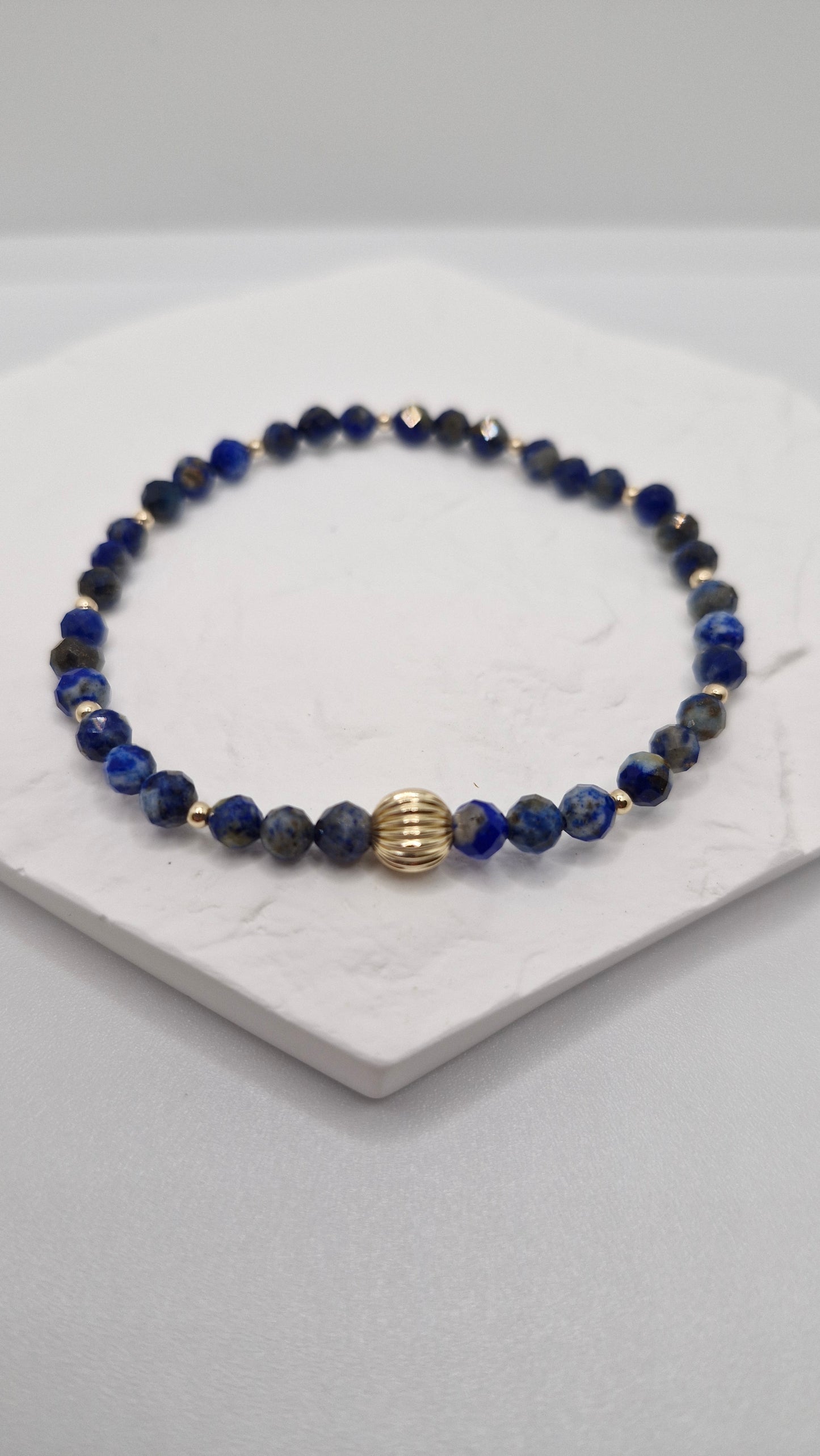 Unisex Lapis Lazuli bracelet featuring faceted beads and gold filled accents for everyday wear