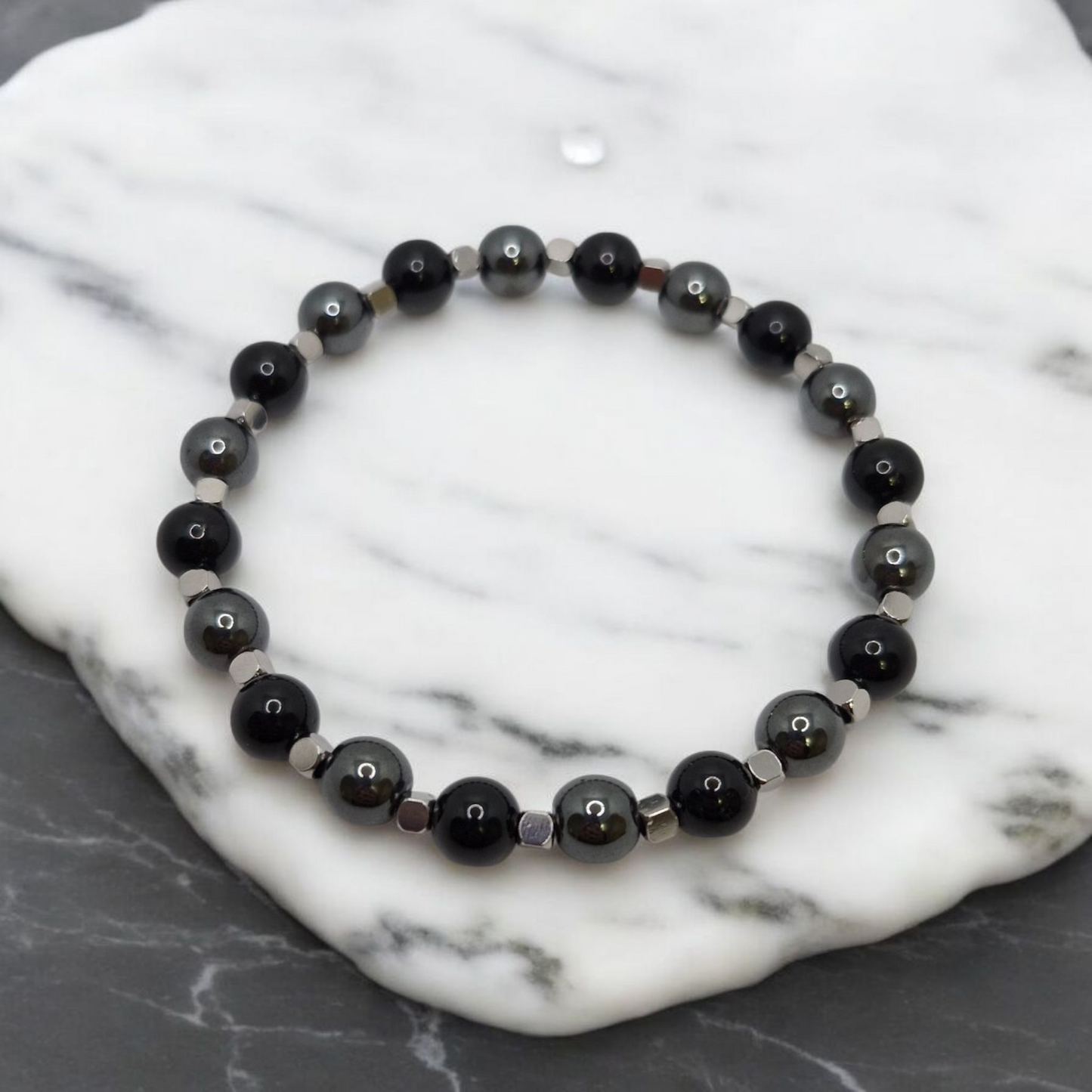 Close-up of 8mm Black Tourmaline and AAA Hematite beads with silver metal spacers
