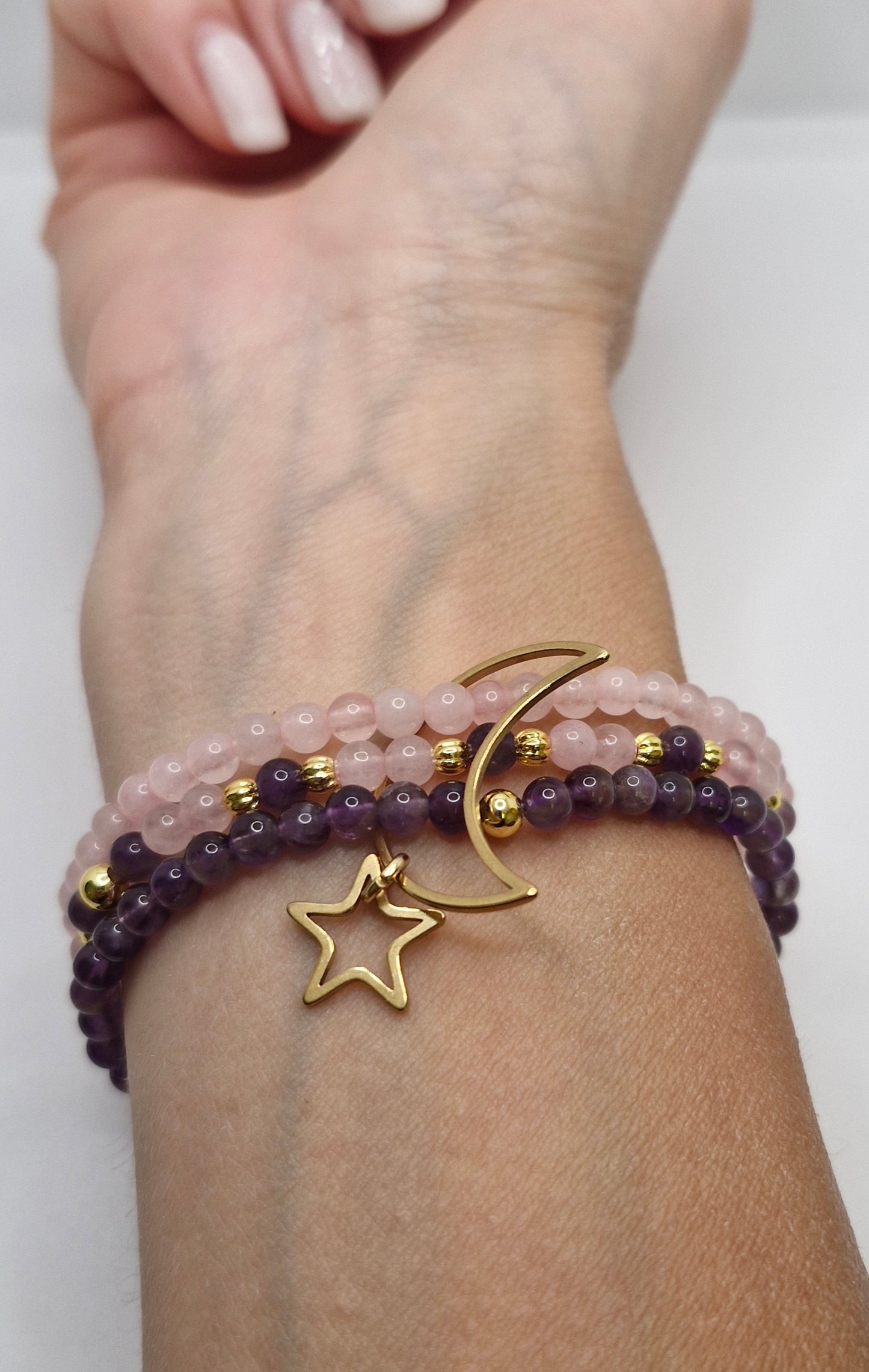 Elegant gemstone bracelet showcasing Brazilian Amethyst, Rose Quartz, and gold-plated details for a celestial look