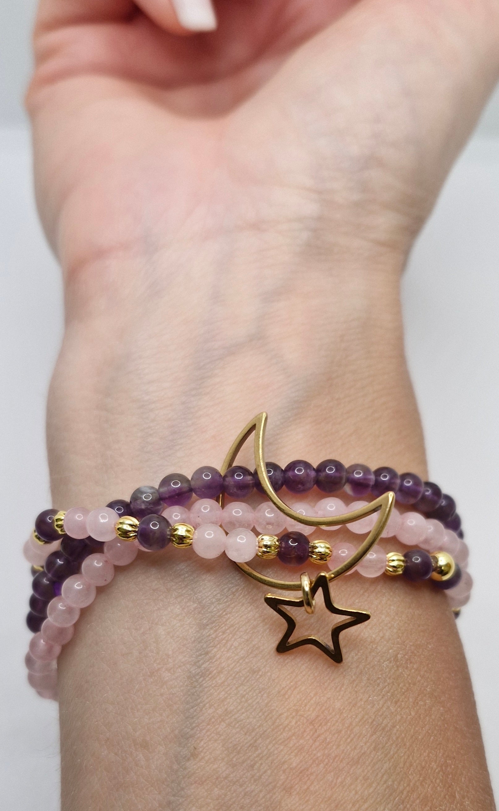 Stacked gemstone bracelet with pink and purple natural stones, gold-plated accents, and Moon & Star stainless steel charm