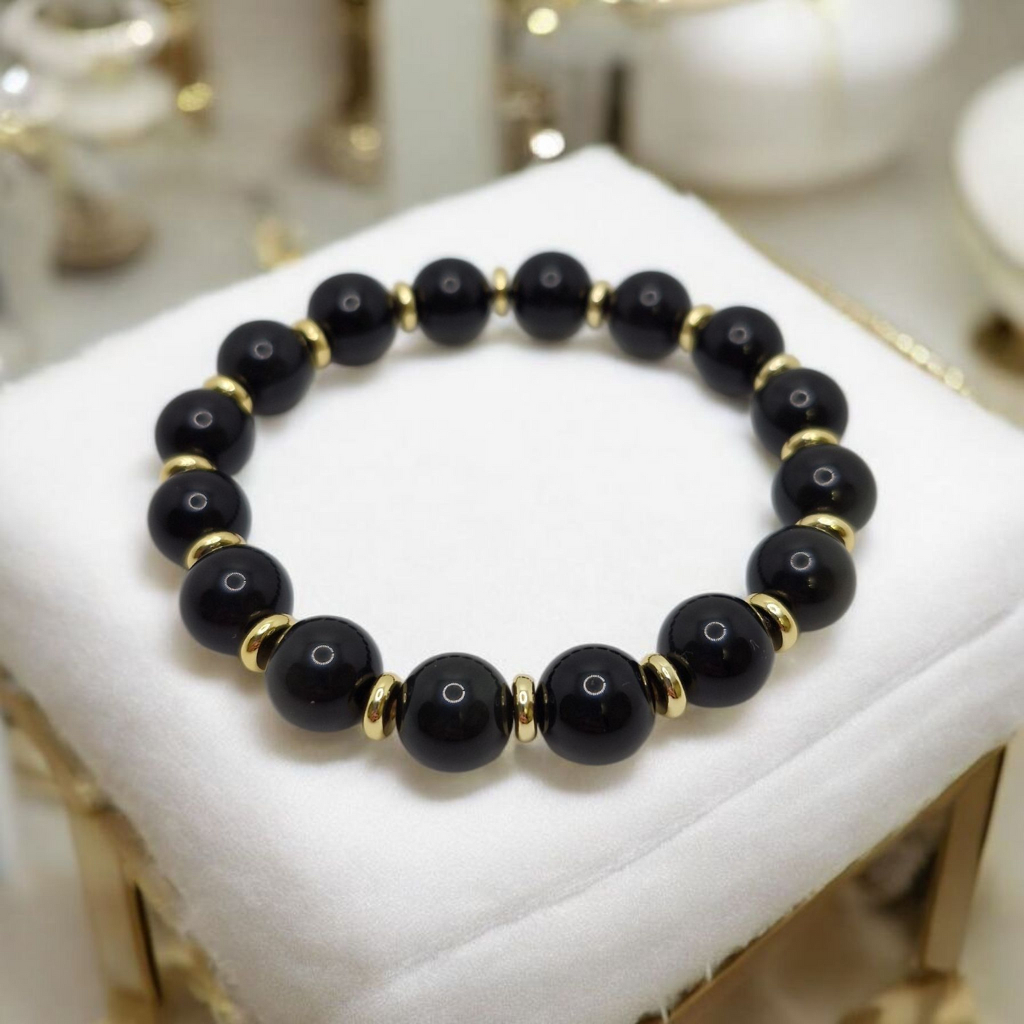 Elegant unisex gemstone bracelet for grounding and protection with black Obsidian and gold-plated accents