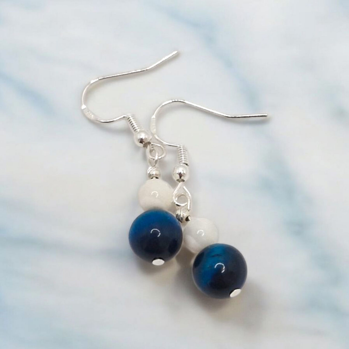 Elegant gemstone earrings featuring 6mm Mother of Pearl and 8mm Blue Tiger Eye beads