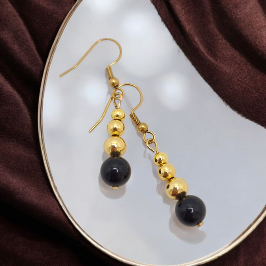 Elegant Grade A Black Tourmaline dangle earrings accented with gold-plated brass beads