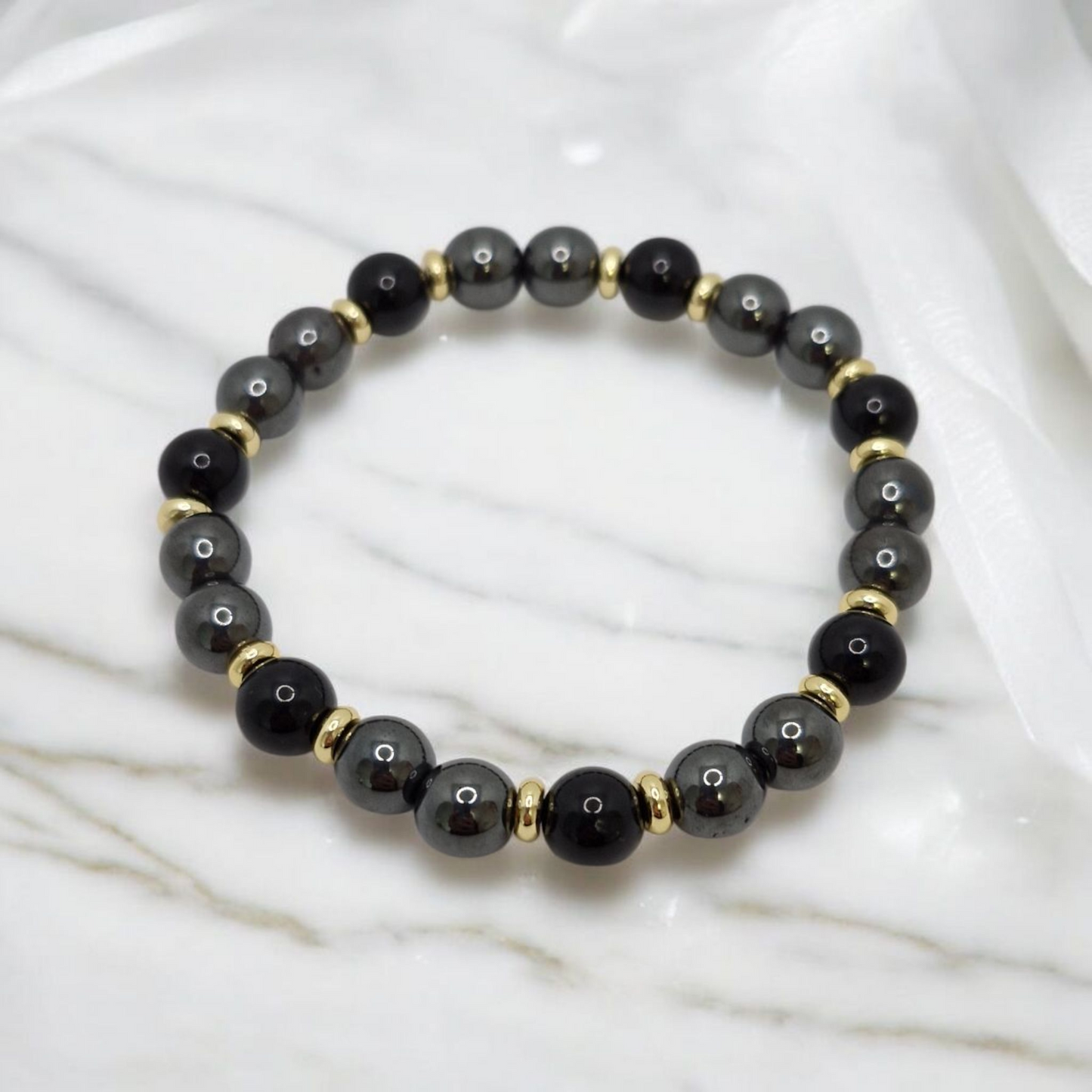 Elegant gemstone stretch bracelet featuring Black Tourmaline and AAA Hematite for grounding and protection