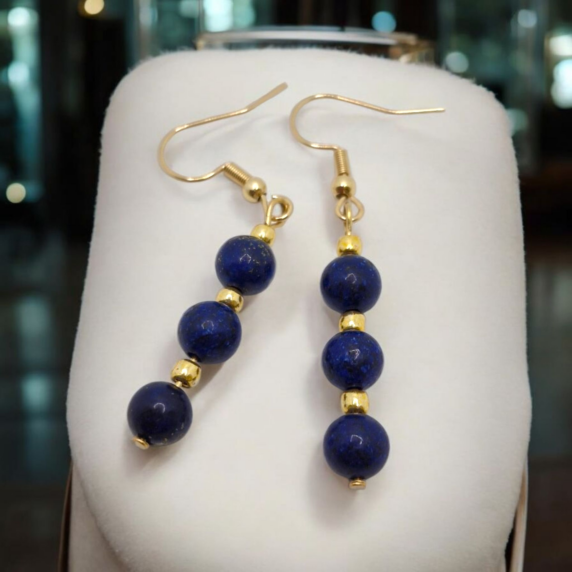 Handcrafted Lapis Lazuli earrings with 8mm smooth blue gemstone beads and Toho accents, finished with gold-plated stainless steel hooks – bold yet timeless design.