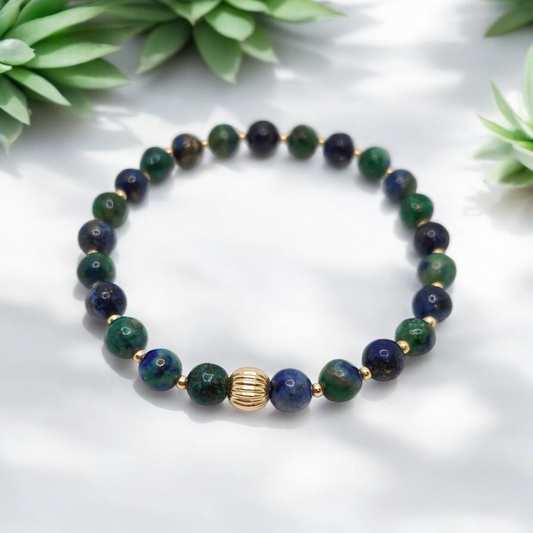 Blue-green Chrysocolla gemstone bracelet with 2mm and 6mm gold-filled accent beads on stretch cord.