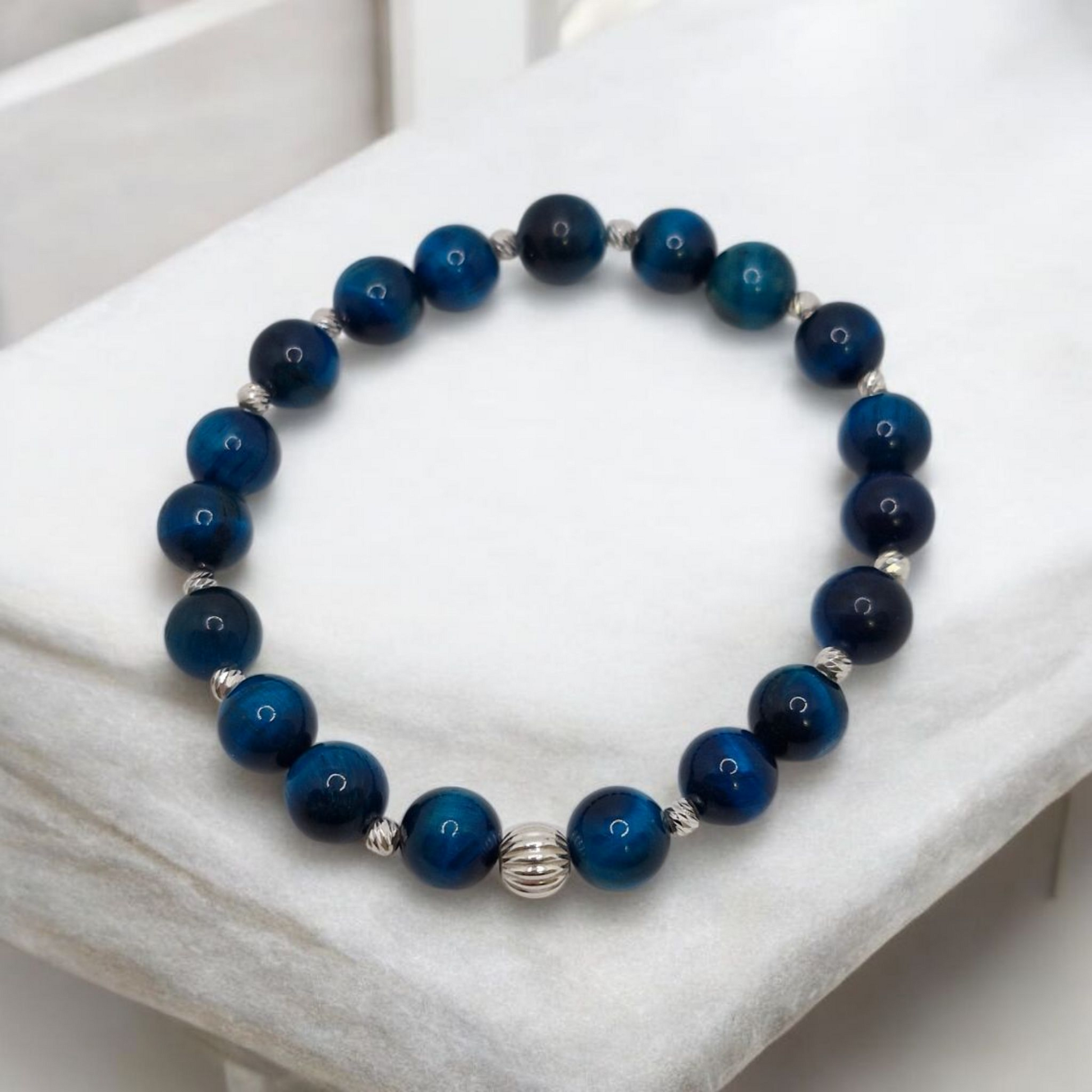 Blue beaded bracelet on a white surface