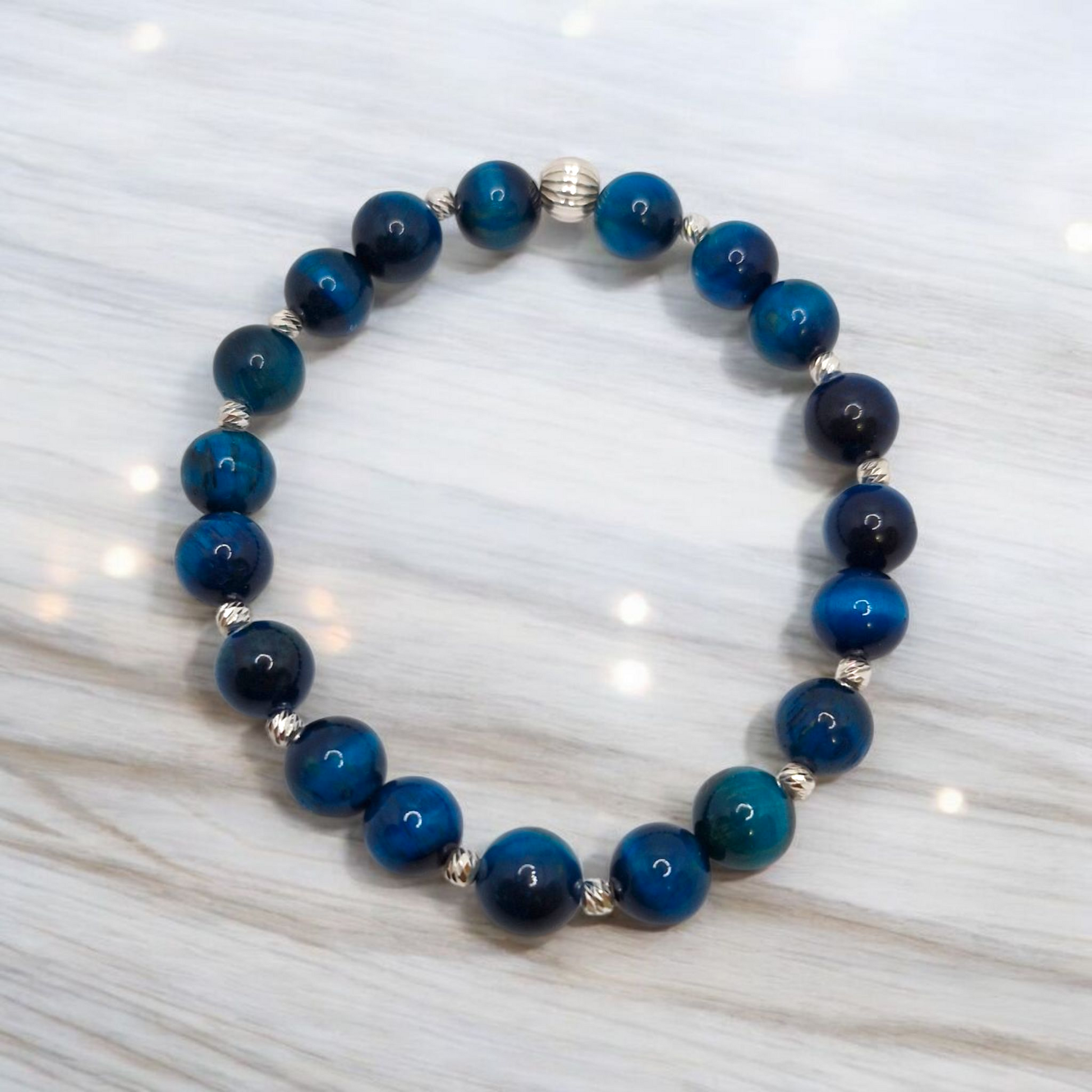 Blue beaded bracelet on a light wood surface
