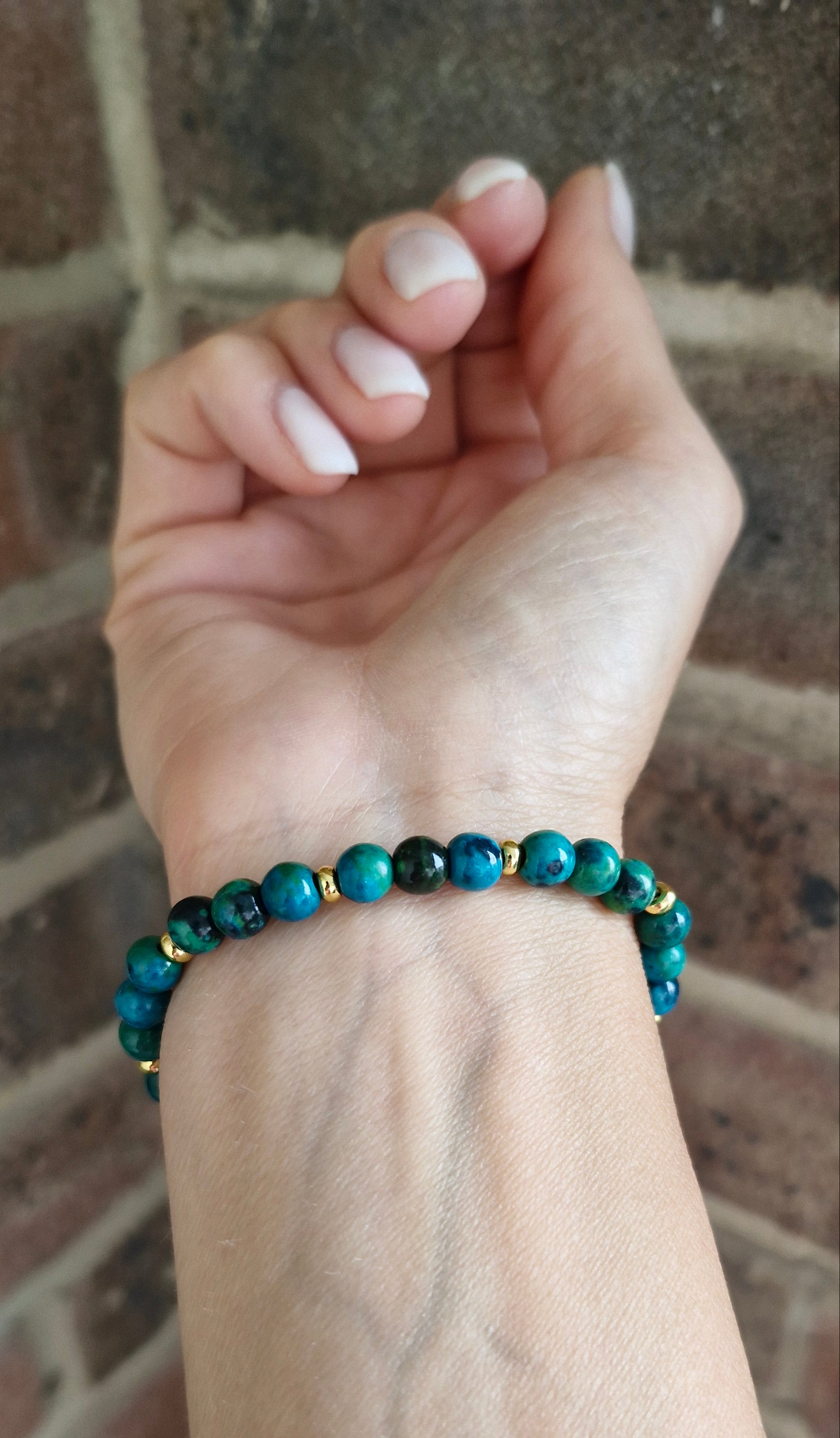 Close-up of Chrysocolla stretch bracelet highlighting 18K gold-plated beads