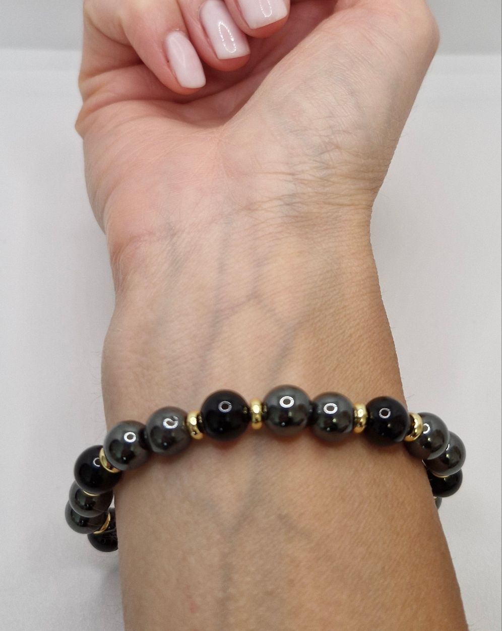 Natural Black Tourmaline and Hematite bracelet with gold-plated accents, handcrafted for everyday wear
