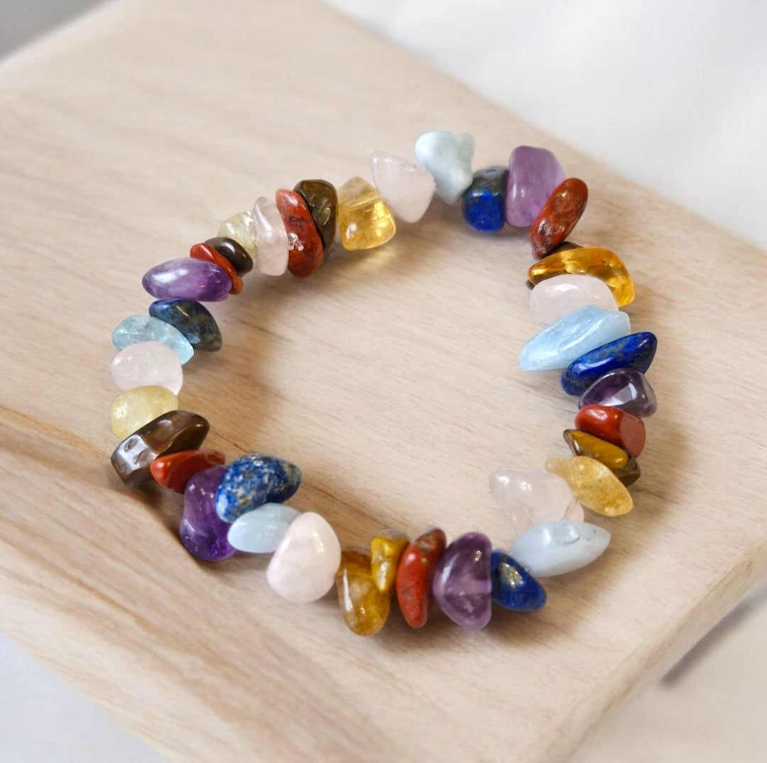 Handmade multicolor chakra chip bracelet with natural gemstones including Red Jasper, Tiger Eye, Citrine, Green Aventurine or Rose Quartz, Aquamarine, Lapis Lazuli, and Amethyst on stretch cord