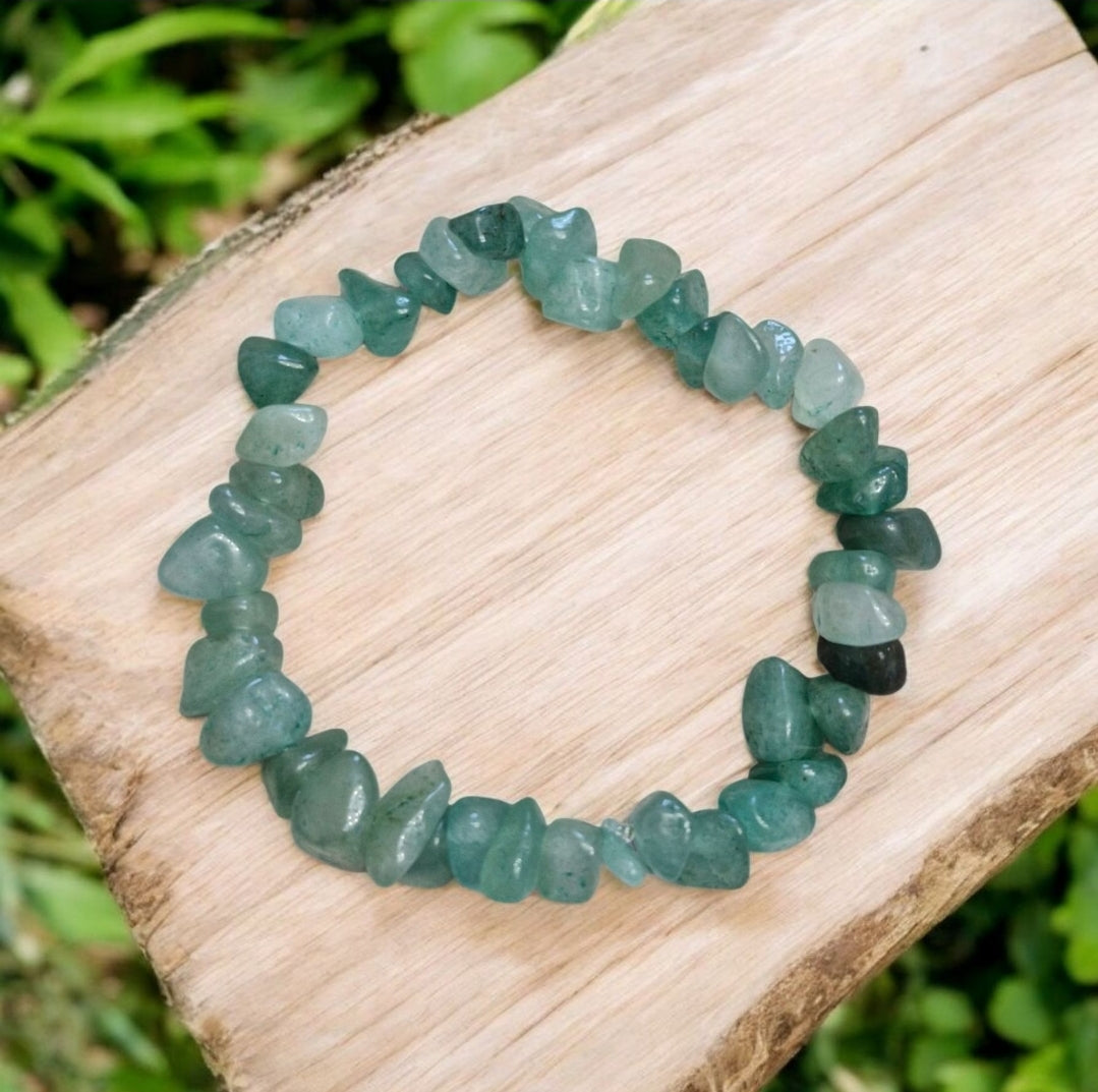 Green Aventurine bead in 7-chakra bracelet supporting luck, healing, and heart energy