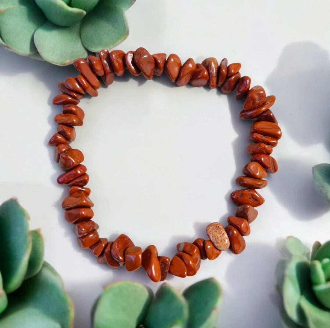 Red Jasper bead in chakra bracelet providing grounding, stability, and energy balance