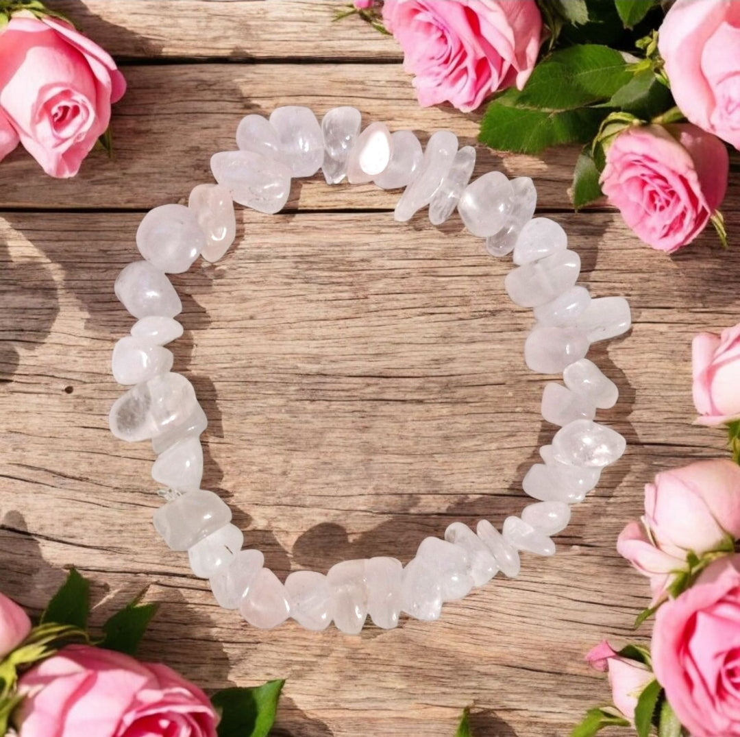 Rose Quartz gemstone bead in handmade chakra stretch bracelet promoting love and compassion