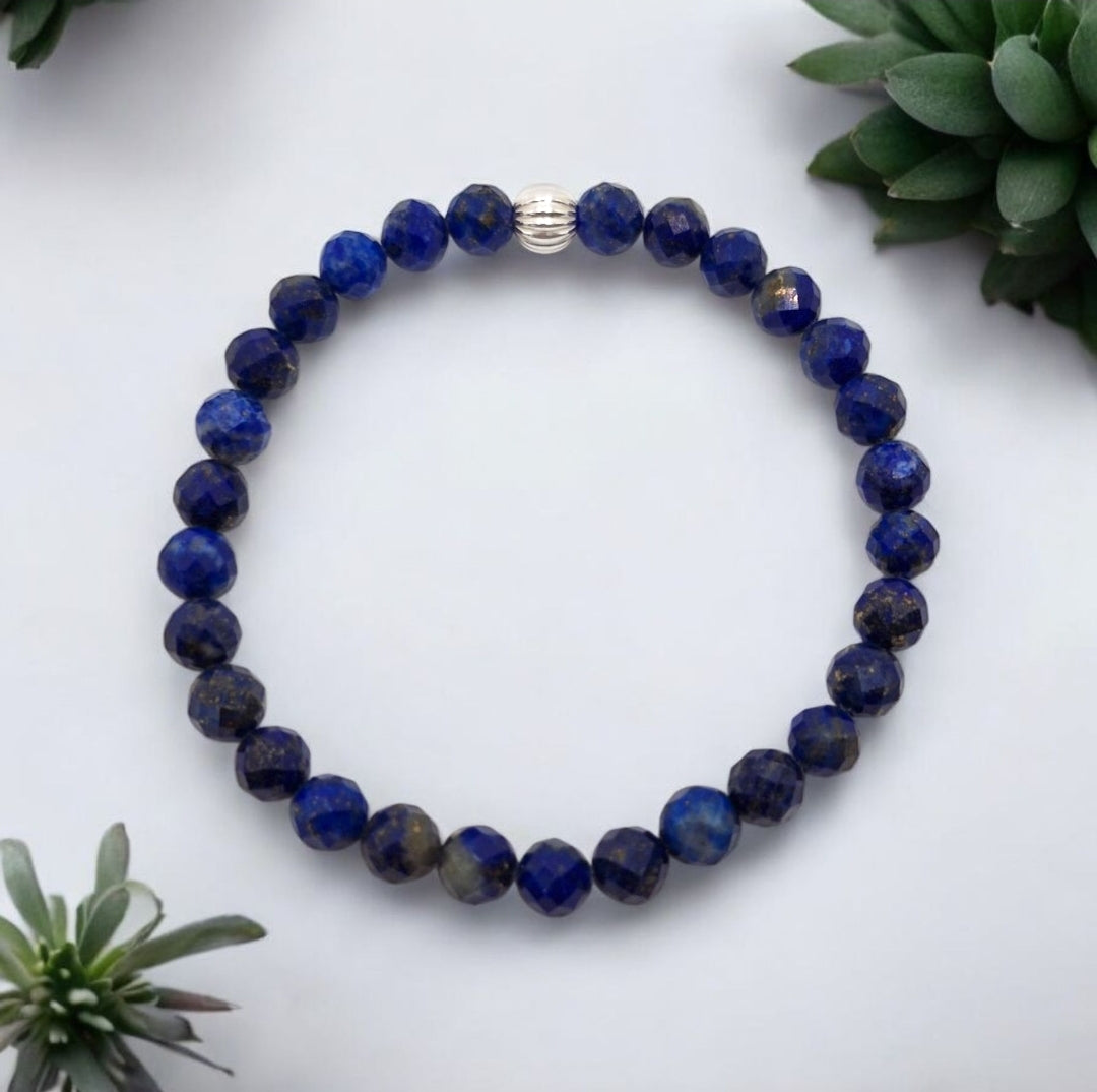 Handmade blue gemstone bracelet with faceted Lapis Lazuli beads and silver accent, meaningful chakra jewelry