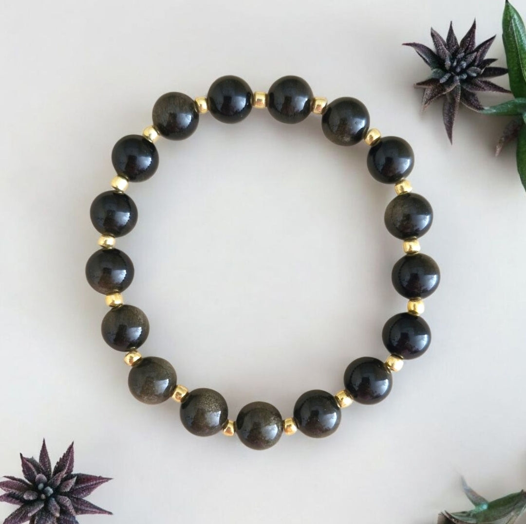 Handmade Obsidian stretch bracelet with 8mm natural gemstone beads and shimmering 3mm gold Toho glass beads on stretch cord.