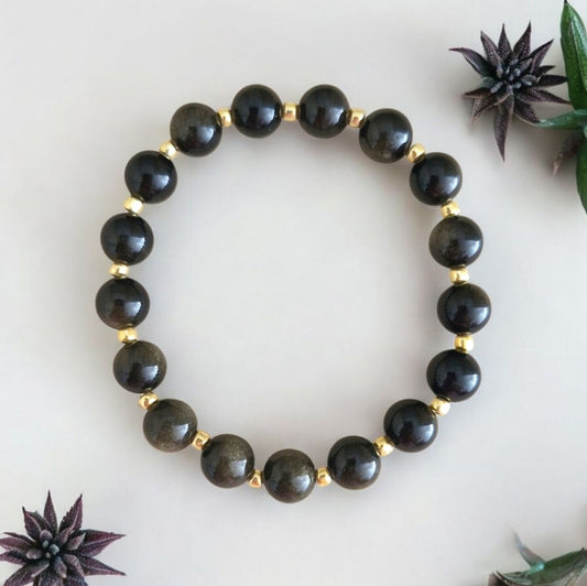 Handmade Obsidian stretch bracelet with 8mm natural gemstone beads and shimmering 3mm gold Toho glass beads on stretch cord.