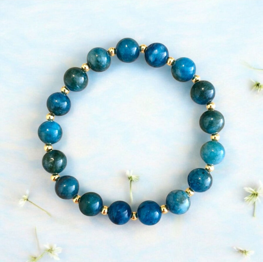 Handmade Blue Apatite stretch bracelet with 8mm natural stones and 2.5mm gold-plated beads.