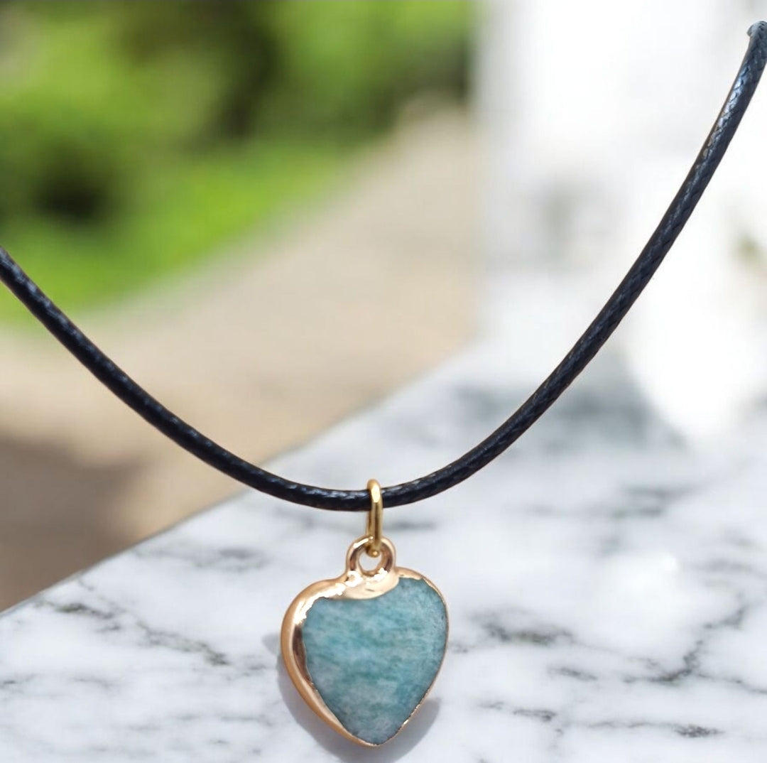 Faceted turquoise-green Amazonite heart pendant with black cord, crystal healing jewellery