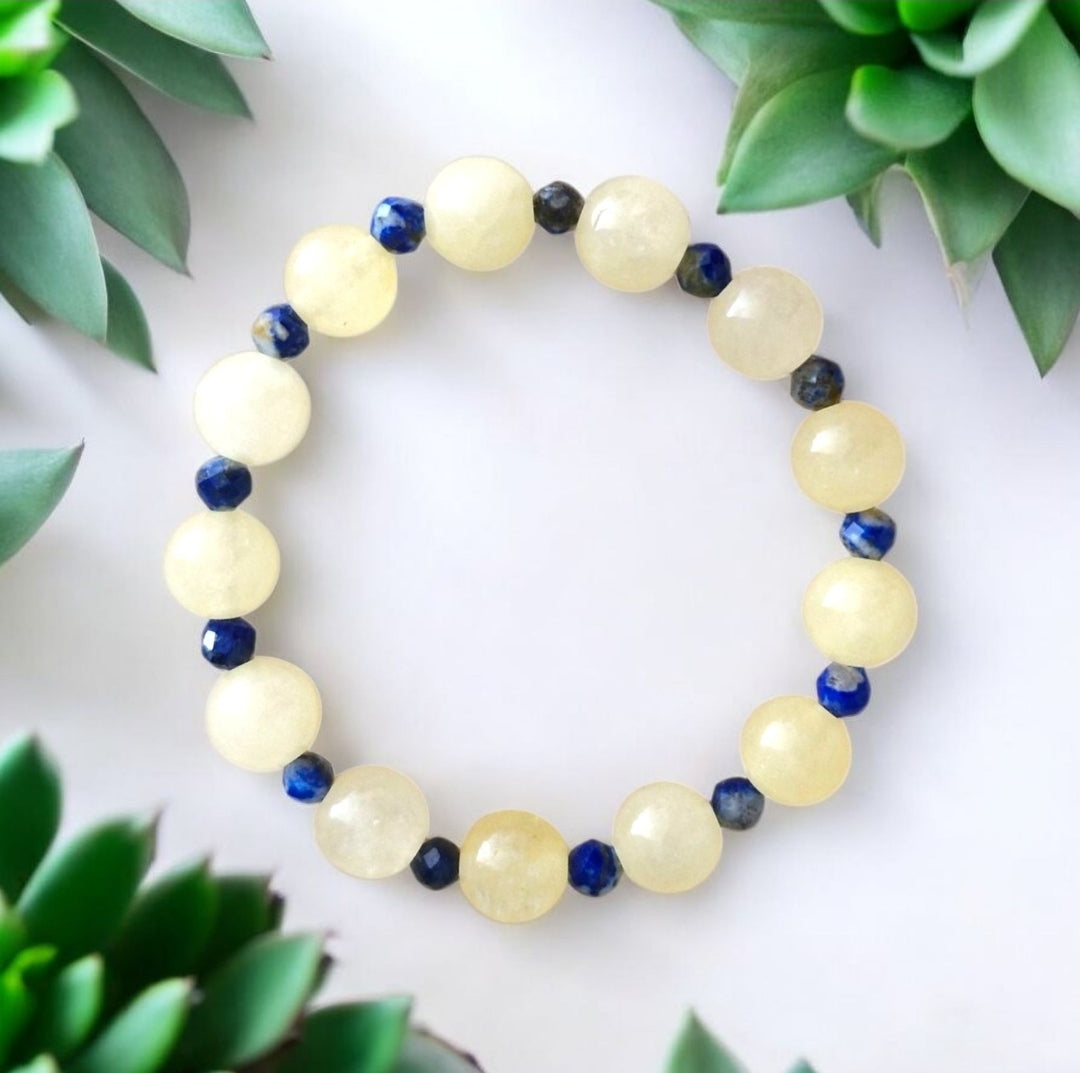 Handmade Golden Citrine stretch bracelet with 8mm gemstones and 4mm faceted Lapis Lazuli accent beads on stretch cord.