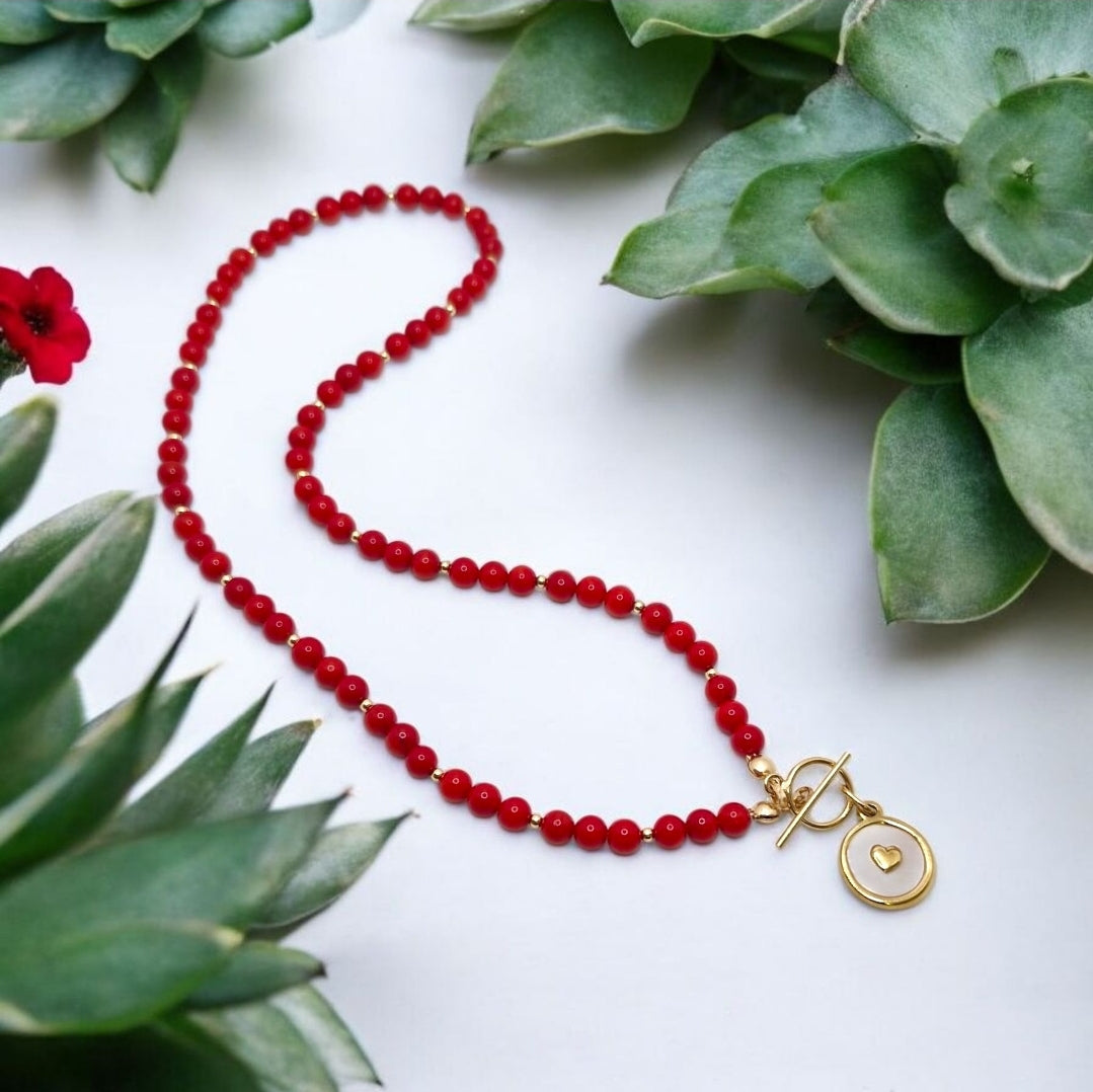 Close-up of Red Bamboo Coral gemstone beads with gold filled details on handmade necklace