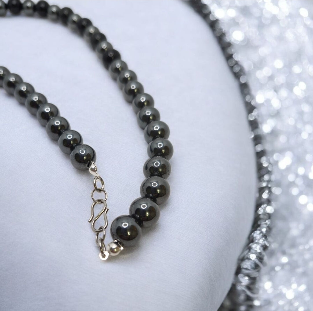 Elegant Obsidian necklace with grounding energy, paired with metallic Hematite beads