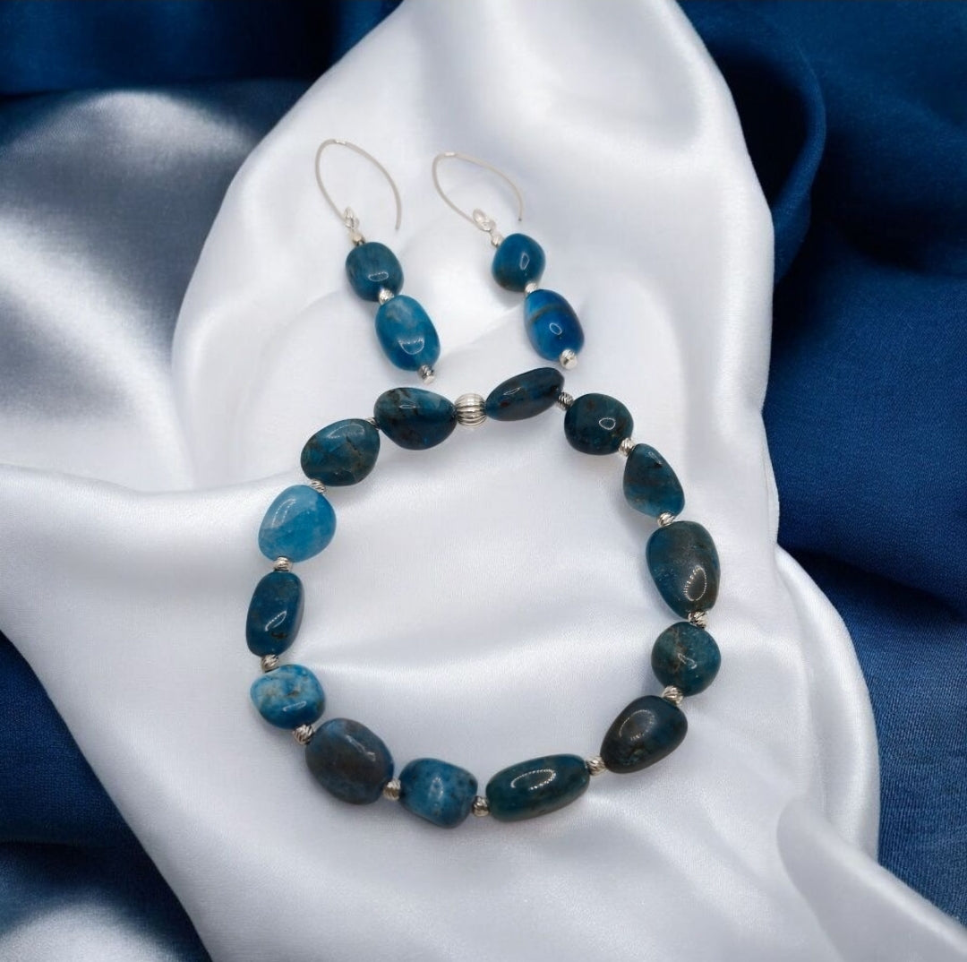 Close-up of Apatite gemstone bracelet with sterling silver beads paired with matching earrings