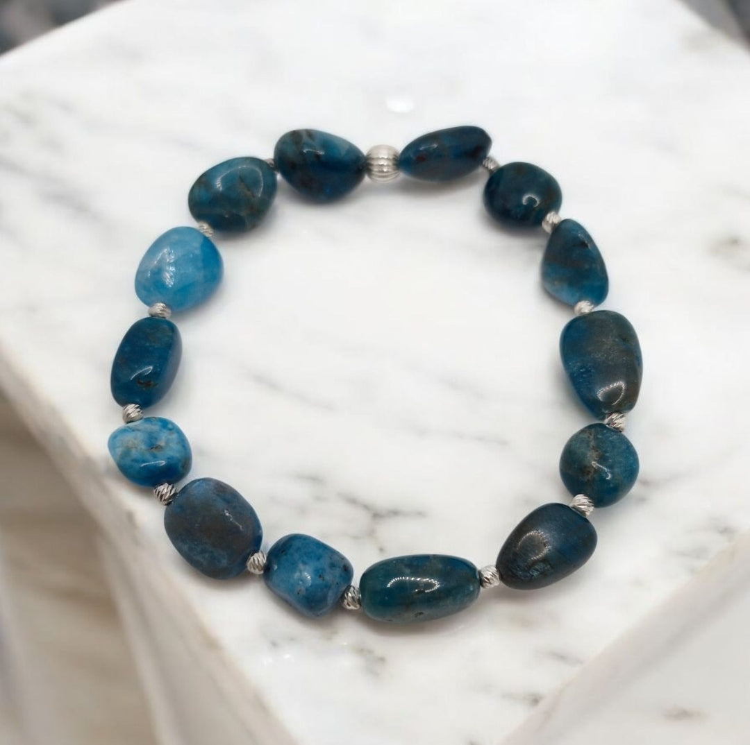 Close-up of natural blue Apatite nuggets with 2.5mm and 5mm sterling silver beads on stretch bracelet