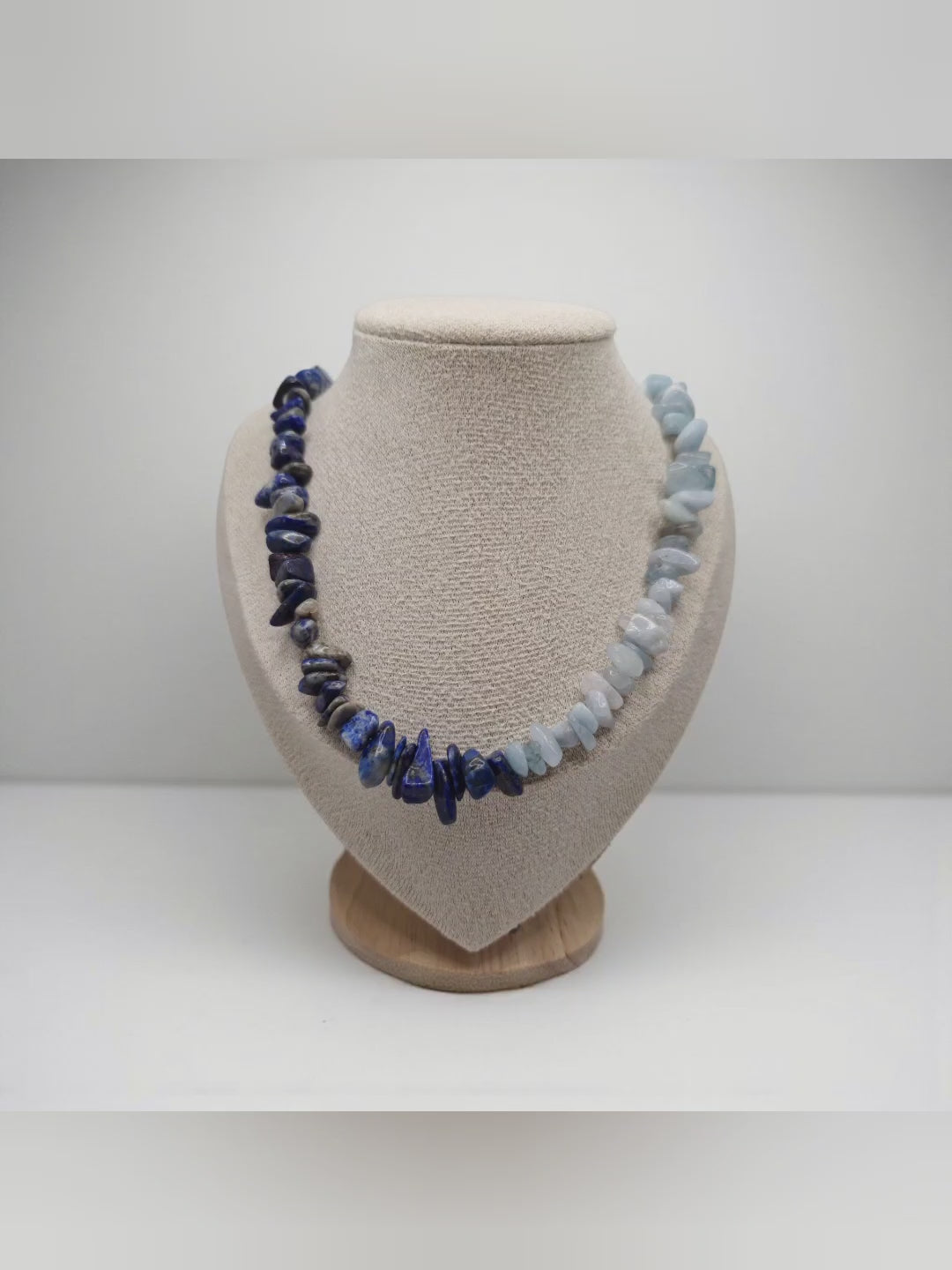 Video of aquamarine and lapis lazuli chip necklace worn on neck, showing stainless steel S-hook clasp.