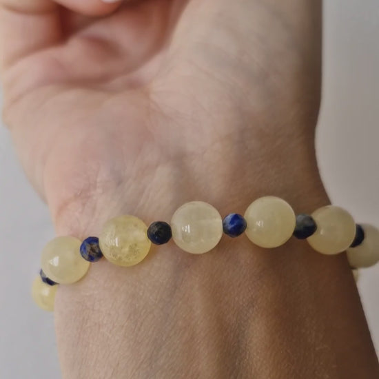 Video of handmade Golden Citrine stretch bracelet with 8mm stones, featuring 4mm Apatite or Lapis Lazuli accent beads for vibrant two-tone design.