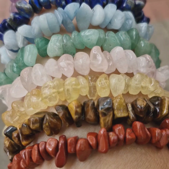 Handmade 7-chakra gemstone stretch bracelet video showing Rose Quartz, Lapis Lazuli, Amethyst, Citrine, Aquamarine, Green Aventurine, Red Jasper, and Tiger Eye beads, with a Selenite strip free gift