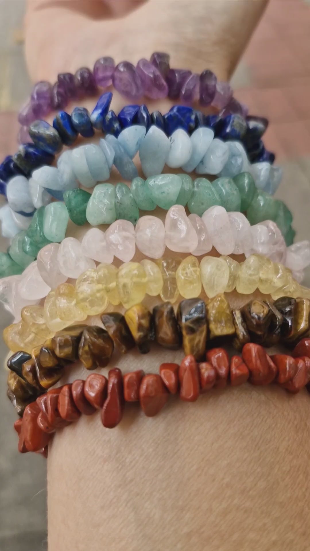 Handmade 7-chakra gemstone stretch bracelet video showing Rose Quartz, Lapis Lazuli, Amethyst, Citrine, Aquamarine, Green Aventurine, Red Jasper, and Tiger Eye beads, with a Selenite strip free gift