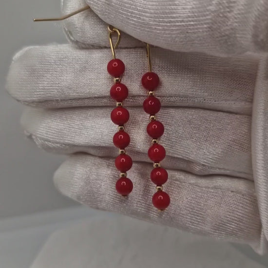 Handmade red coral earrings with 4mm dyed coral beads and gold-filled hooks, showcasing elegant movement and natural beauty