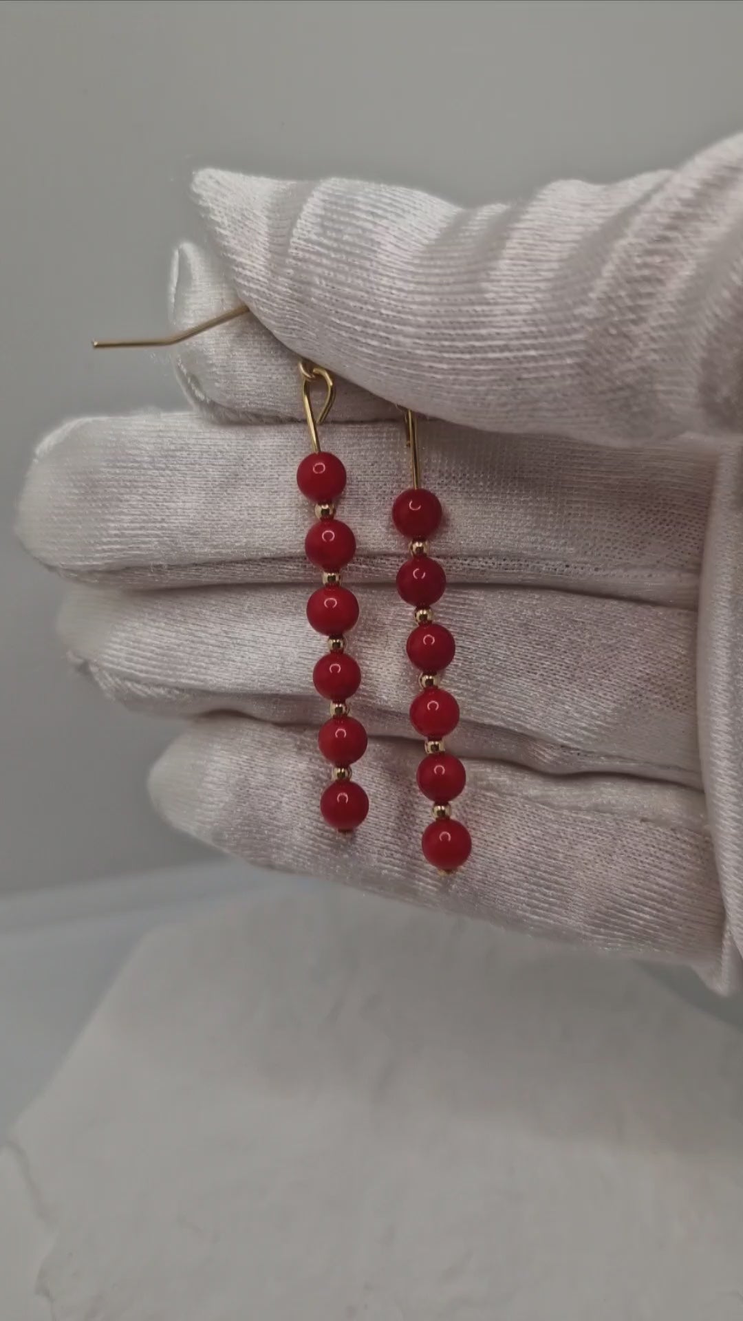 Handmade red coral earrings with 4mm dyed coral beads and gold-filled hooks, showcasing elegant movement and natural beauty
