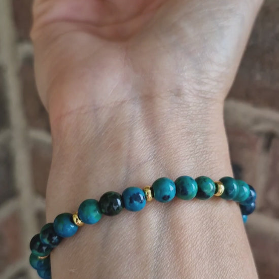 Demonstration of Chrysocolla bracelet worn on wrist, highlighting gold-plated accents