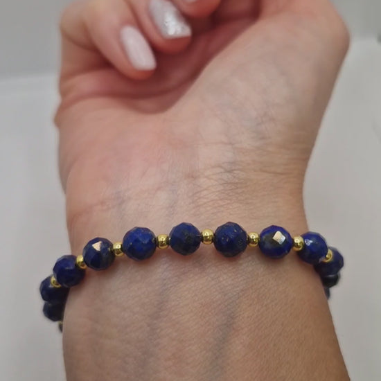 Video showing wearing stretch Lapis Lazuli faceted bracelet with gold accents 
