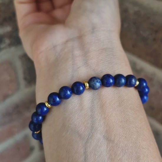 Video showing Lapis gemstone stretch bracelet with 4mm 18K gold-plated disk beads